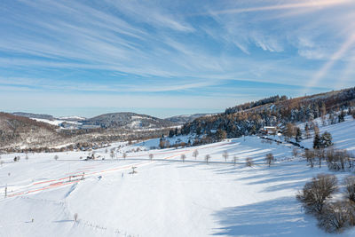 Scenic view of snowcapped mountains against sky