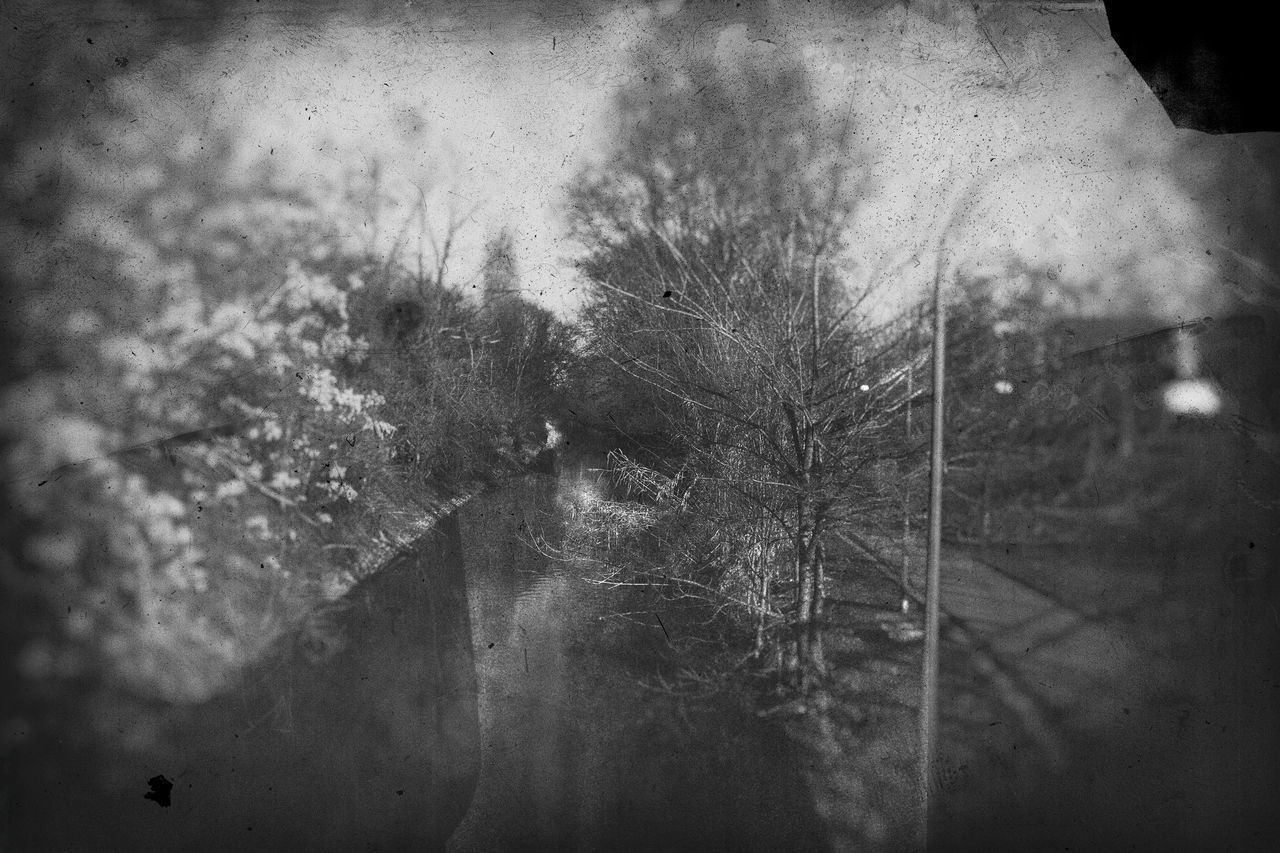 CLOSE-UP OF WET GLASS WINDOW WITH REFLECTION