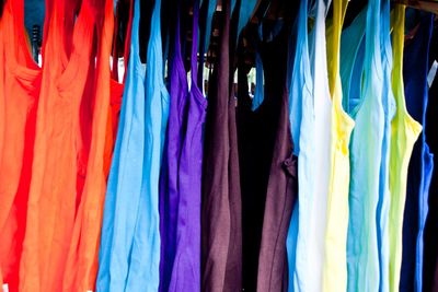 Full frame shot of colorful tank tops for sale at street market