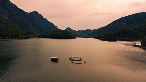 Scenic view of lake against sky during sunset