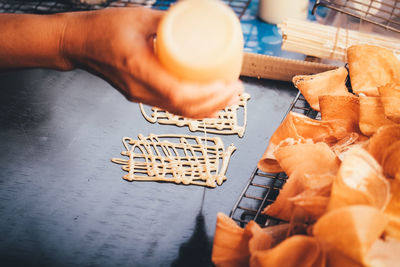 High angle view of person preparing food on table