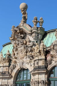 Low angle view of statue against clear blue sky