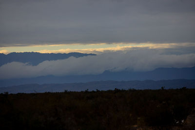 Scenic view of mountains against sky during sunset