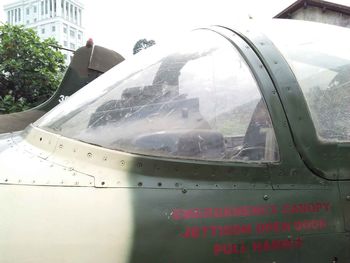 Close-up of airplane seen through glass window