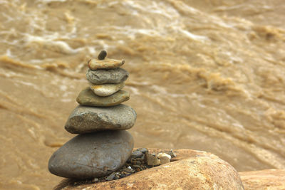 Close-up of stone stack on rock