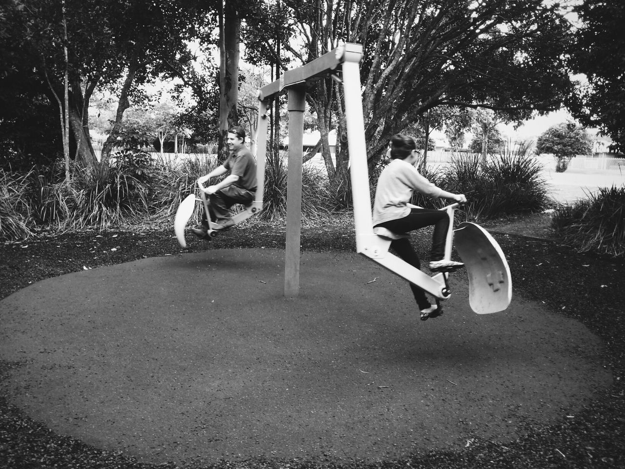 tree, childhood, transportation, toy, grass, day, full length, land vehicle, human representation, park - man made space, outdoors, sunlight, playground, animal representation, absence, mode of transport, art and craft, bicycle, art, abandoned