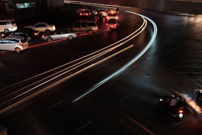 High angle view of light trails on road in city