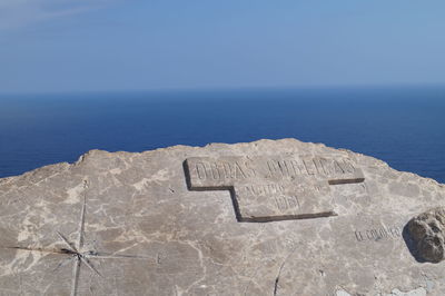 Close-up of sea against blue sky