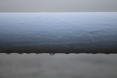 Close-up of raindrops on snow