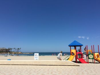 Scenic view of sea against blue sky