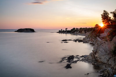 Scenic view of sea against sky during sunset