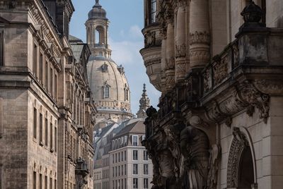 Buildings in city against sky