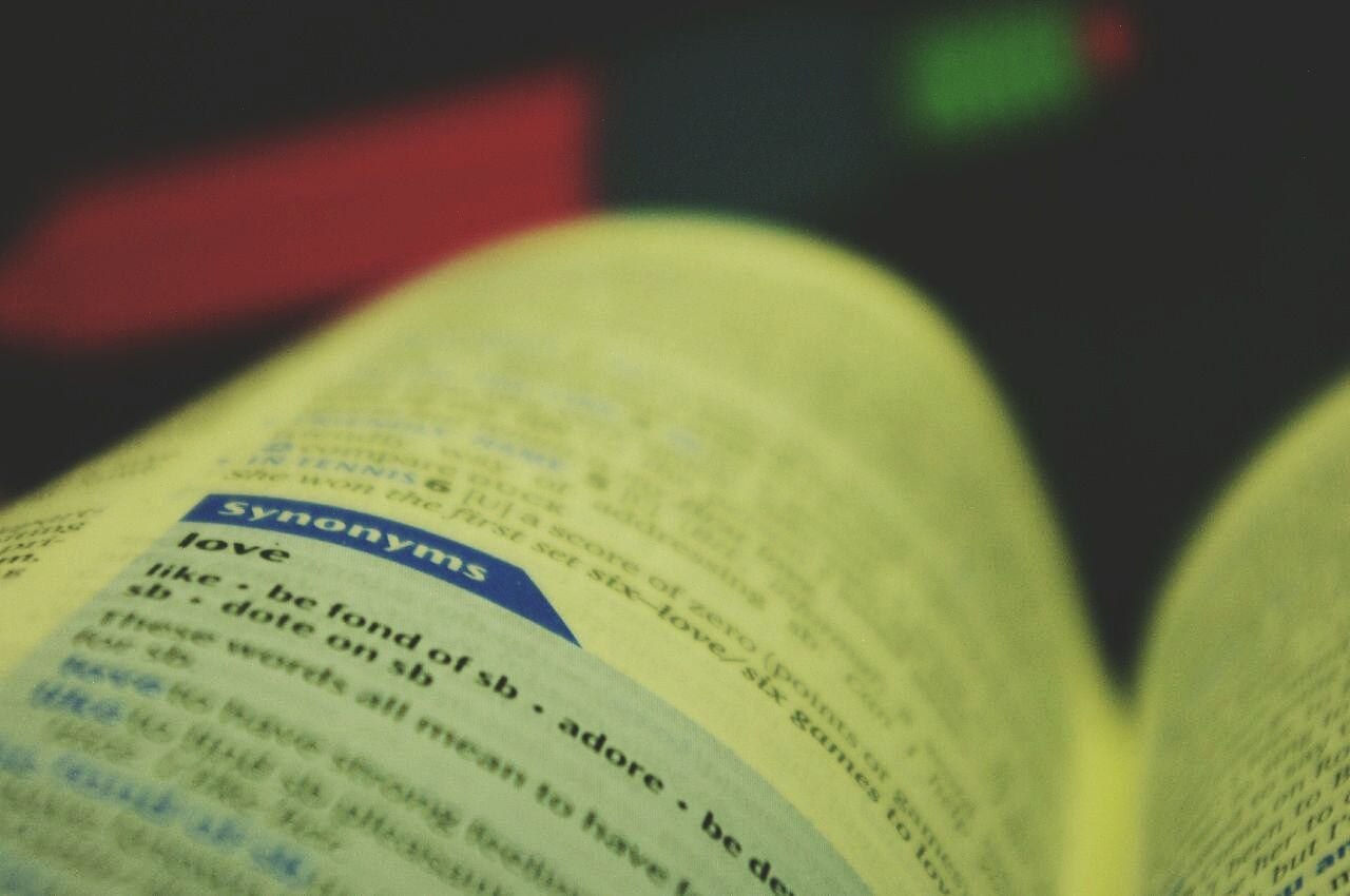 text, communication, western script, close-up, green color, indoors, focus on foreground, paper, selective focus, book, still life, no people, education, non-western script, number, detail, information, day, capital letter, single object