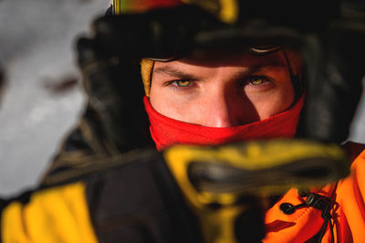 Portrait of a man in a balaclava and a ski helmet on his head. close-up of a caucasian man's face