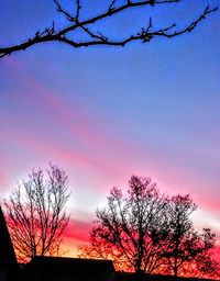 Low angle view of silhouette tree against sky at sunset