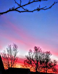 Low angle view of silhouette tree against sky at sunset