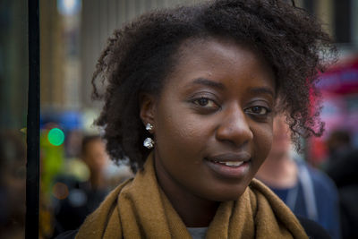 Close-up of smiling woman with curly hair