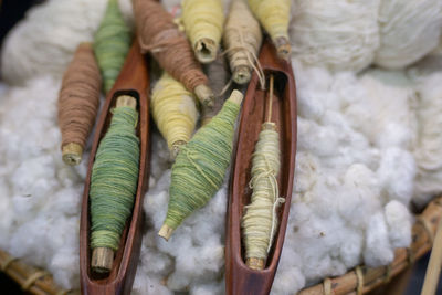 High angle view of threads and cotton