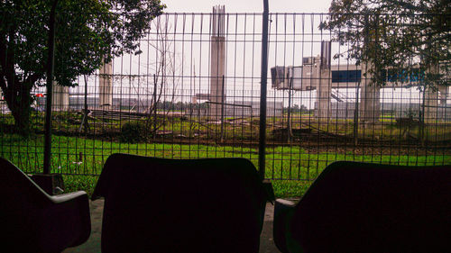 View of empty chairs against plants