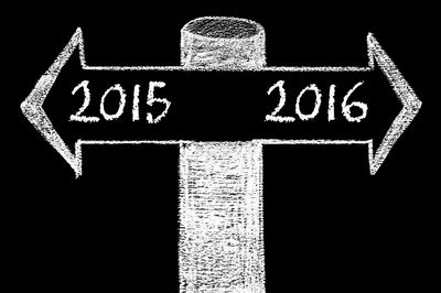 Close-up of arrow sign against black background