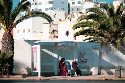 People sitting in front of building