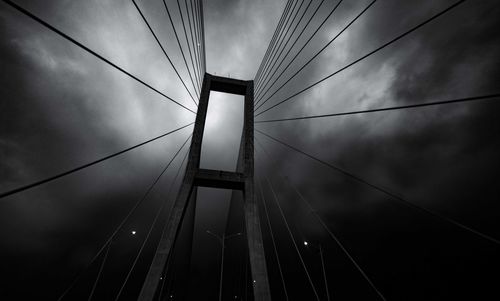 Low angle view of illuminated bridge against sky