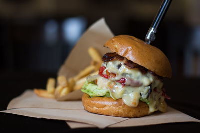 Close-up of burger and french fries on table