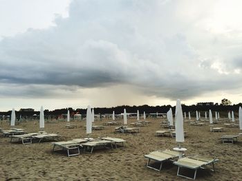 View of beach against cloudy sky
