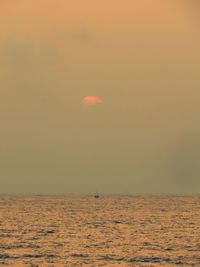 View of calm sea at sunset