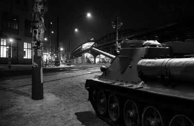 Armored tank on street at night