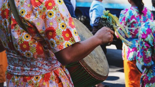 Rear view of women standing outdoors