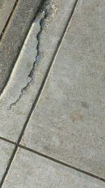 High angle view of shadow on footpath