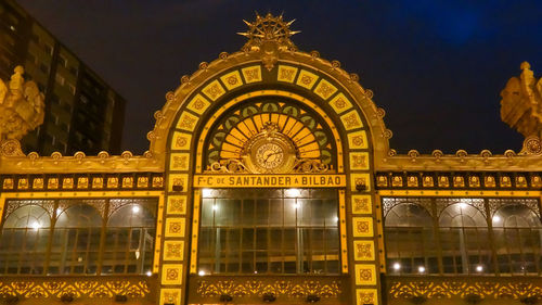 Low angle view of illuminated building at night