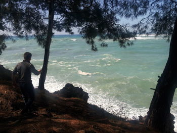 View of people standing on rocks