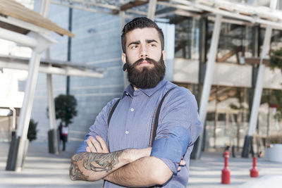 Portrait of young hipster in the heart of city