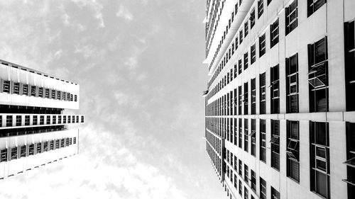 Low angle view of office building against sky