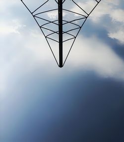 Low angle view of electricity pylon against sky