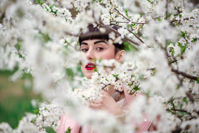 Close-up portrait of fashion model by tree