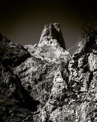 Rock formations on mountain against sky