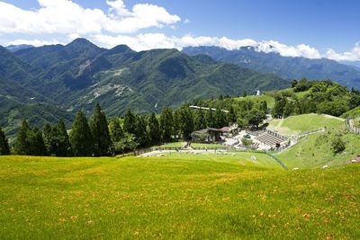 Scenic view of landscape and mountains against sky