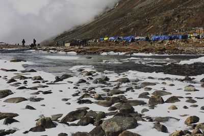 Scenic mountain landscape and snow covered river valley at zero point or yumesodong, sikkim in india 