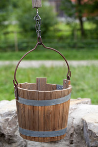 Close-up of wicker basket hanging from tree