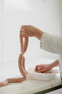 Close-up of man preparing food on table