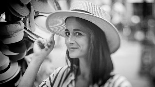 Close-up portrait of woman wearing hat in market