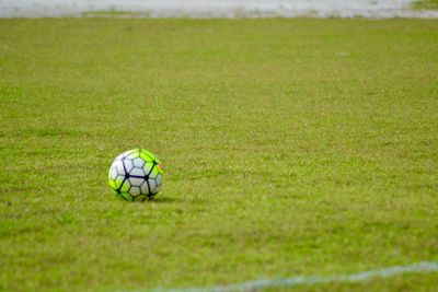 Close-up of soccer ball on field