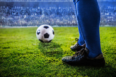 Low section of person on soccer field