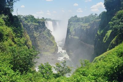 Scenic view of waterfall, victoria falls in zambezi river, zimbabwe 