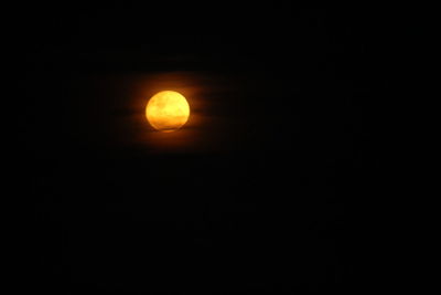 Scenic view of moon against dark sky