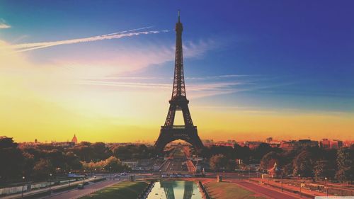 Eiffel tower against sky during sunset