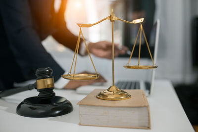 Close-up of clock on table